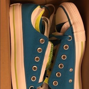 Blue and white low top converse in a size 9.
